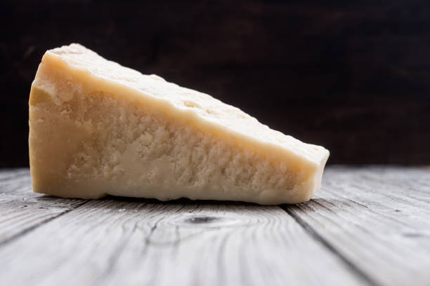 istock Italian hard cheese  on the old wooden table 911702944