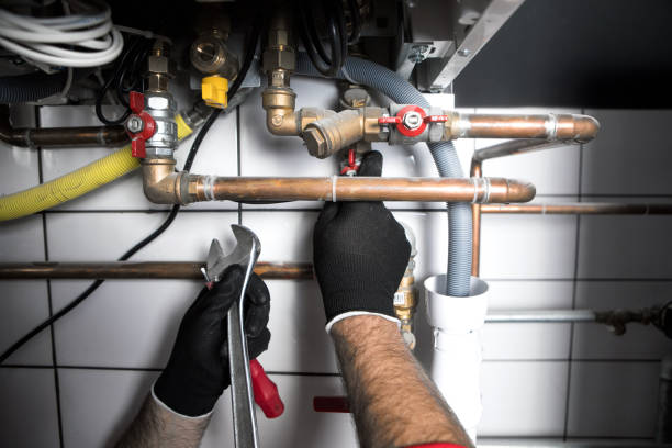 Hands of Plumber with a wrench plumber working at home, work at the heating installation plumbing fixture stock pictures, royalty-free photos & images