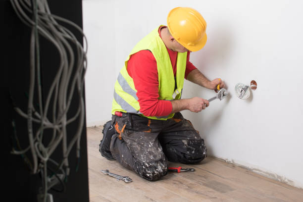 istock Hands of Plumber with a wrench 911703472
