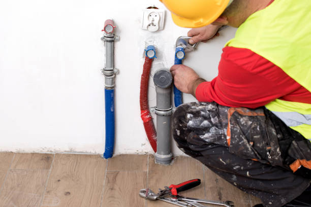 istock Hands of Plumber with a wrench 911709652