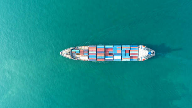 istock container,container ship in import export and business logistic,By crane,Trade Port , Shipping,cargo to harbor.Aerial view,Water transport,International,Shell Marine,transportation,logistic,trade,port 911712020
