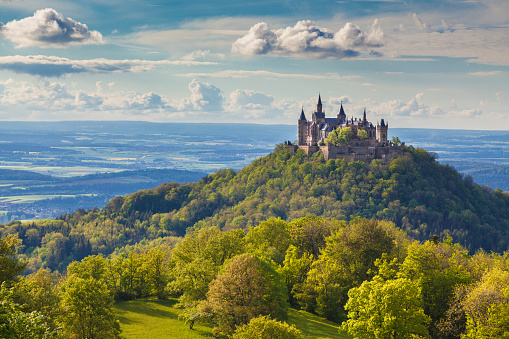 Aerial view of famous Hohenzollern Castle, ancestral seat of the imperial House of Hohenzollern and one of Europe's most visited castles, in beautiful golden evening light, Baden-Wurttemberg, Germany