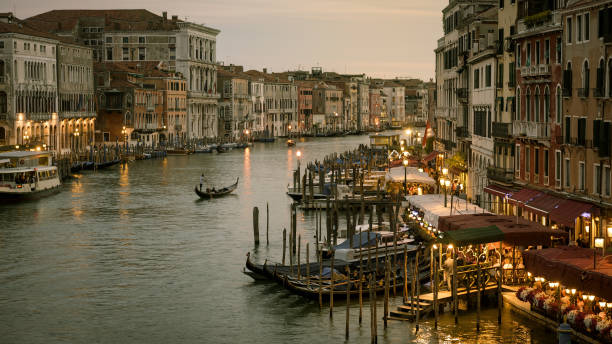 istock Grand Canal with gondolas at night in Venice, Italy 911712966