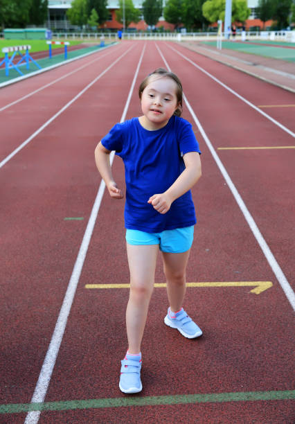 istock Little girl have fun on the stadium 911713288