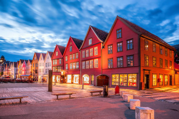 Bergen street with old houses at night in Norway, UNESCO World Heritage Site Bergen street with old houses at night in Norway, UNESCO World Heritage Site bergen norway stock pictures, royalty-free photos & images