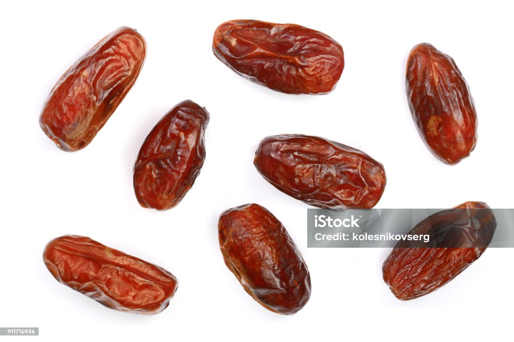 dry dates isolated on white background. Top view. Flat lay pattern dry dates isolated on white background. Top view. Flat lay pattern. Cut Out Stock Photo