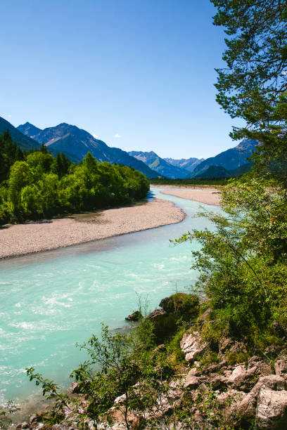 istock Lechriver in summer, near Forchach, Lechtaler Alps, Tyrol, Austria 911717062