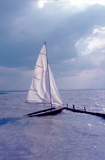 istock Small sailboat at the wooden pier 911717376
