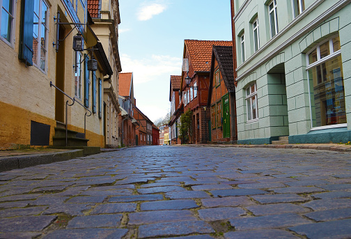 Historical cobblestone alley with half-timbered houses