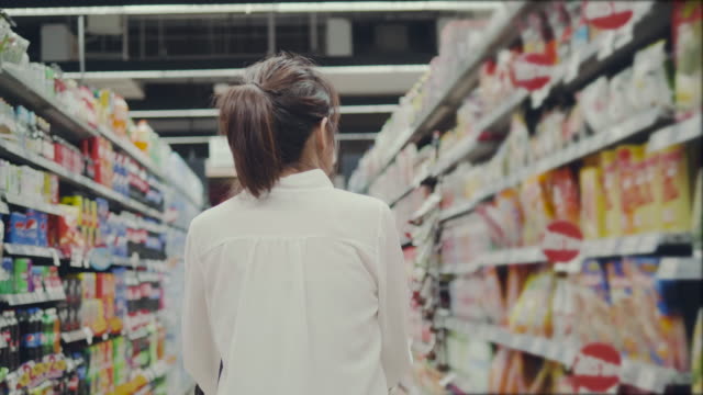 Asian young woman shopping in supermarket