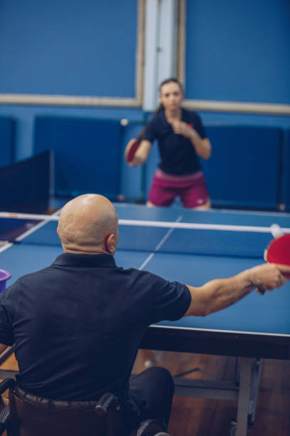istock Man and woman playing table tennis 911723428