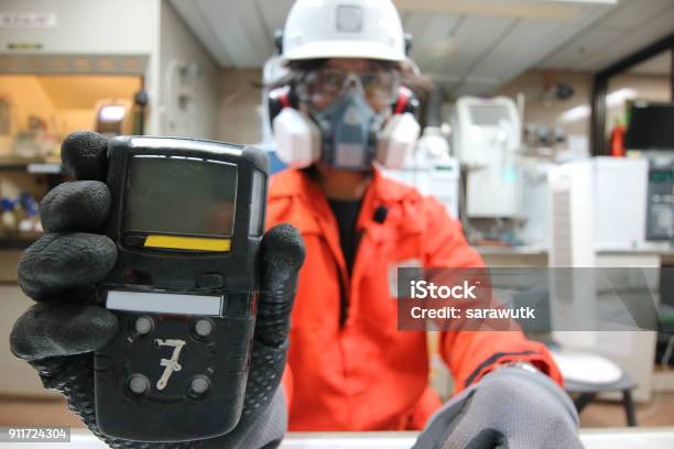 Instrument Technician Is Take Standard Gas For The Job Calibrate Or Function Check Of Personal Gas Tester Or Gas Detector Stock Photo - Download Image Now