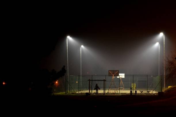 istock illuminated basketball court 911724488