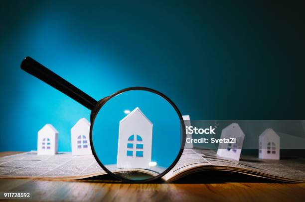 Paper House Under A Magnifying Lens Stock Photo - Download Image Now - House, Real Estate, Discovery