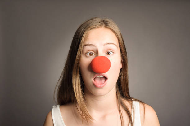 istock young woman with a clown nose 911731442