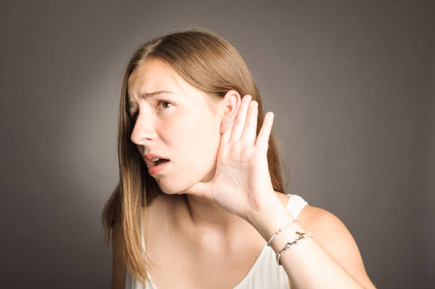 istock Young woman listening something 911731452