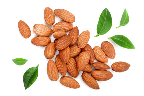 istock almonds with leaves isolated on white background. Top view. Flat lay 911731772