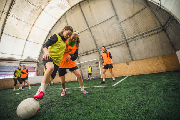 istock Female Soccer Players On A Playing Field 911731824