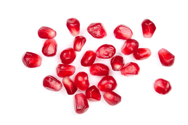 istock pomegranate seeds isolated on white background. Top view. Flat lay pattern 911736116