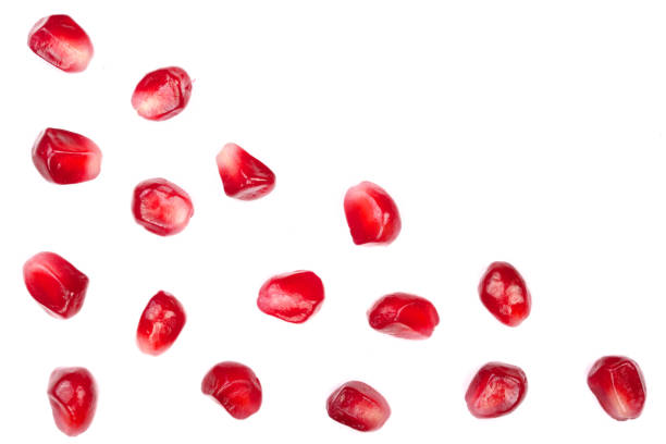 istock pomegranate seeds isolated on white background with copy space for your text. Top view. Flat lay pattern 911736128