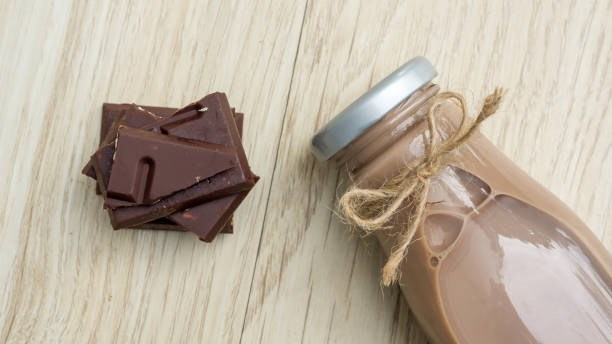 istock Chocolate milk on a wooden table. 911736312