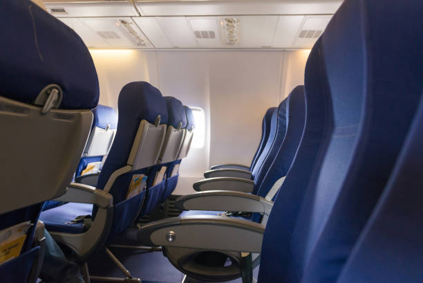 istock Empty airplane seats in the cabin 911736414