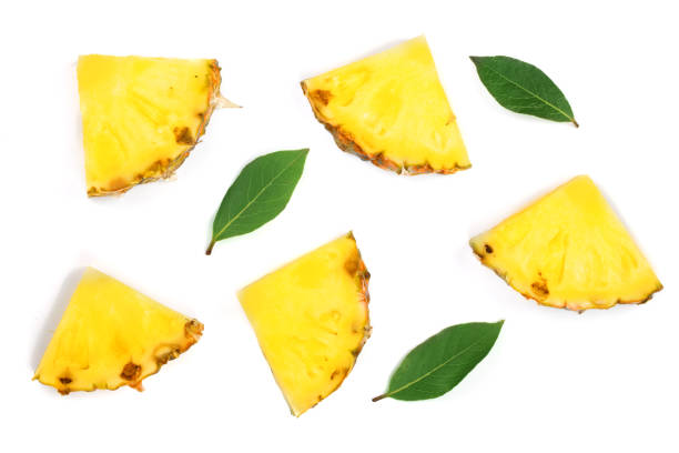 istock Sliced pineapple with green leaves isolated on white background. Top view. Flat lay pattern 911738868