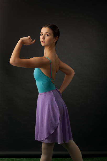 istock Portrait of a young ballet dancer in a studio on a black background 911742786