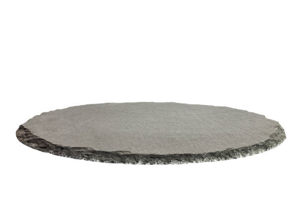 Black round natural tray. Empty kitchen slate board isolated on white background. Restaurant modern utensil