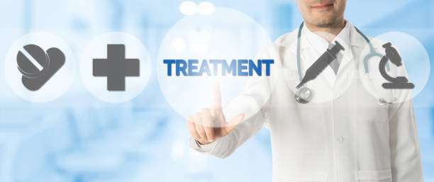 istock Doctor Points at TREATMENT with Medical Icons 911749912