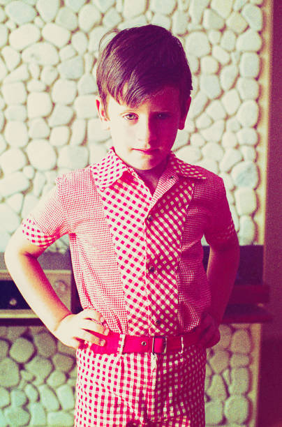 istock Vintage boy standing in front of  the camera 911755486