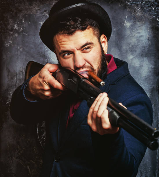 istock Powerful businessman with a gun 911758316