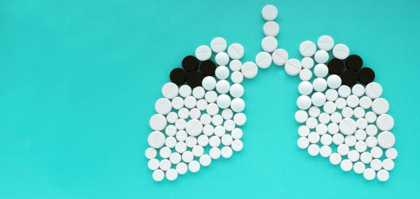 istock Lungs made of pills on mint background. World Tuberculosis Day concept 911765174