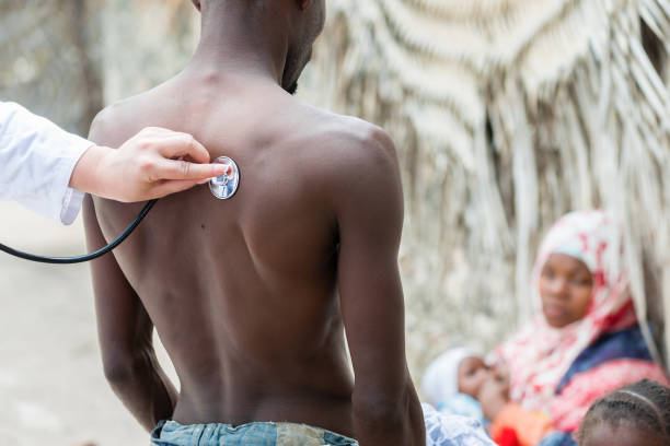 Stethoscope exam of African man stock photo