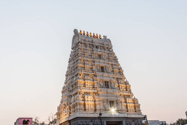 istock Ancient temple tower view of kamakshi amman temple illuminated with lights. Low light photography during sunset. 911765764