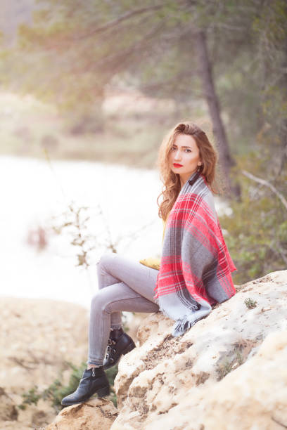 istock Young woman relaxing in the forest 911774298