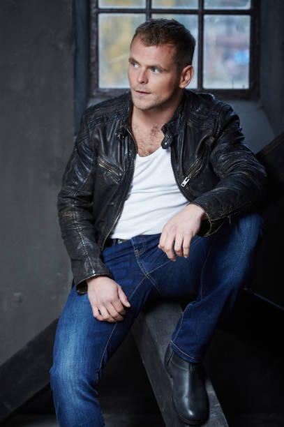 istock Casual man in a jeans and leather jacket. 911790492