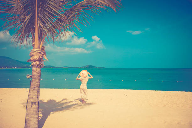istock Woman at tropical beach 911790838