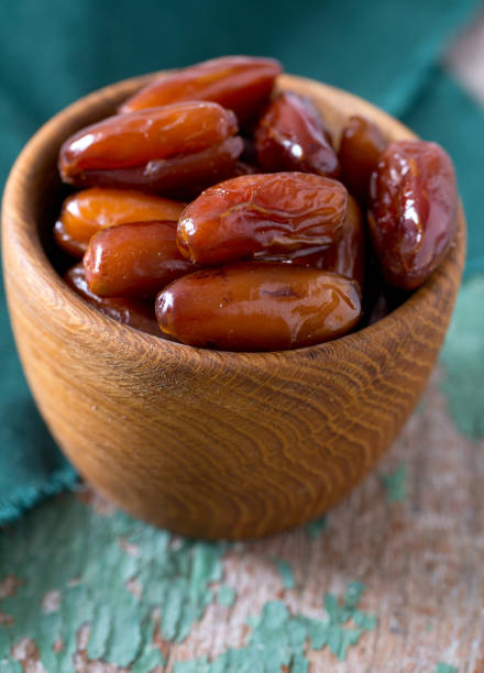istock dried dates on a beautiful wooden background 911793884