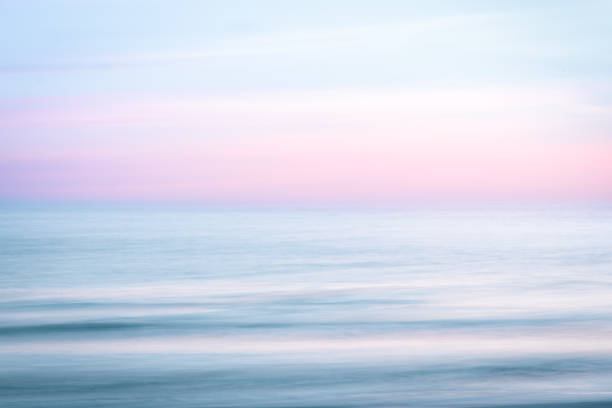 istock Abstract sunset sky and  ocean nature background with blurred panning motion. 911793946