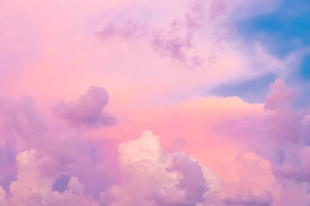 Colorful clouds on sunset sky, nature background stock photo