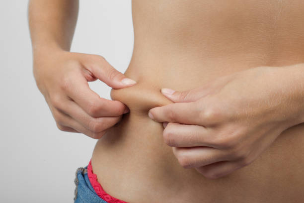 istock Touching her fat belly skin 911801276