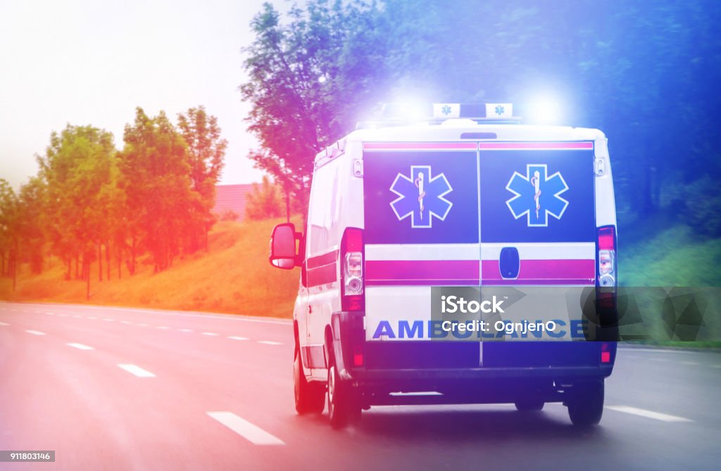 Ambulance van on highway with flashing lights Ambulance Stock Photo