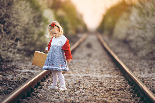 Adorable little girl on railroad