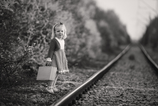 Adorable little girl on railroad