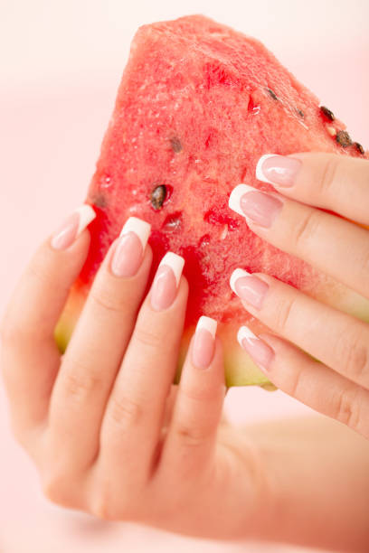 istock Holding a Watermelon With Manicured Nails 911811484