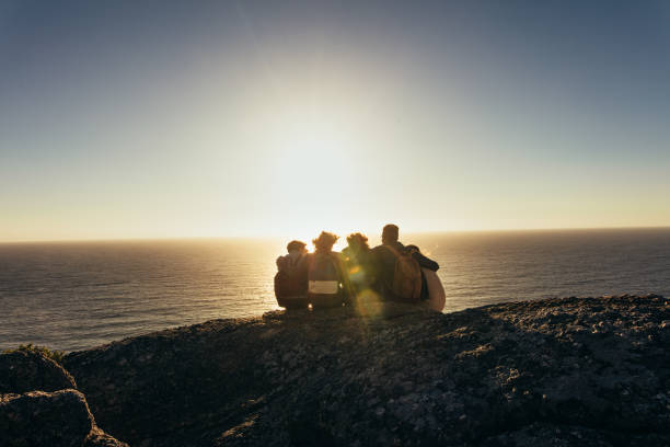 istock Friends admiring the sunset from mountain top 911812134