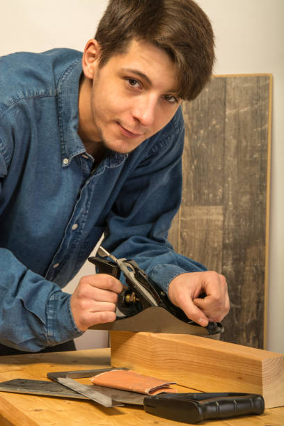 istock young men working on wood 911812626