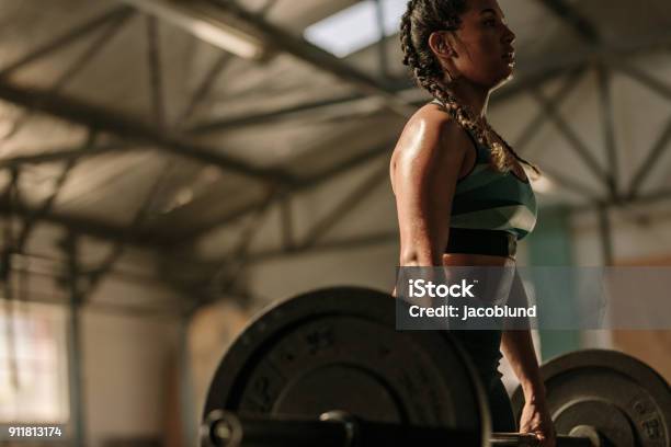 Muscular Woman Doing Heavy Weight Exercises Stock Photo - Download Image Now - Women, Gym, Health Club