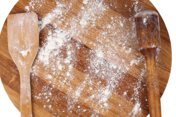 istock white flour on rustic wooden table, top view 911813766